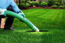 A technician performing septic pumping in Ontario County, NY